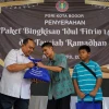 Atang Trisnanto Bersama PGRI Kota Bogor Bagikan Bingkisan Idul Fitri