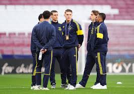 Arsenal staff were seen inspecting the pitch at the Metropolitano ahead of kick-off (PA)