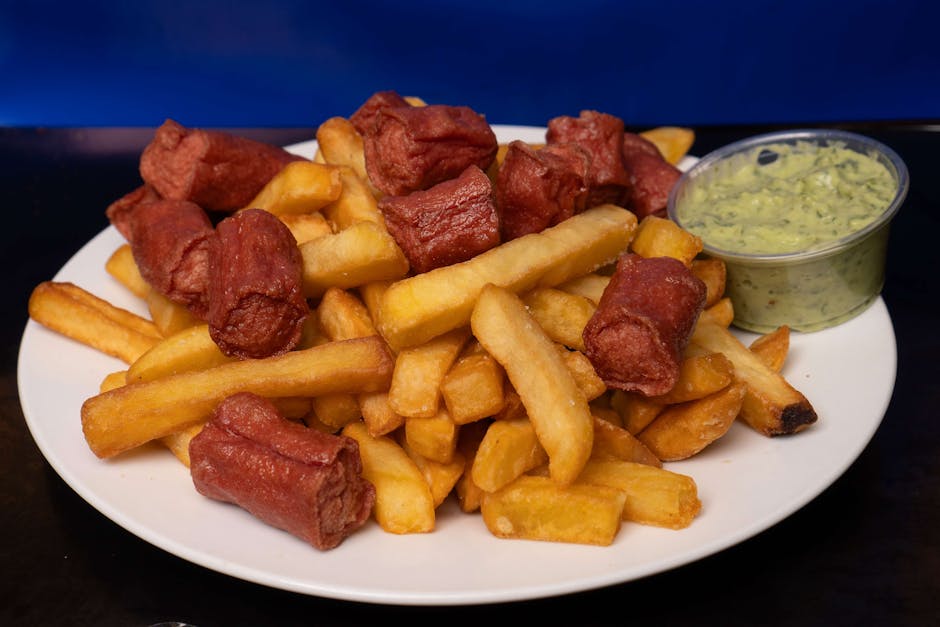 Berbagai macam rempah-rempah kering dan segar khas Indonesia seperti cengkeh, pala, kunyit, dan jahe tertata rapi di atas meja kayu.