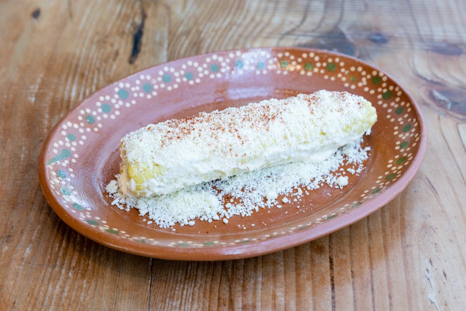 Berbagai jenis rempah-rempah kering khas Indonesia seperti cengkeh, pala, dan kayu manis tertata rapi di atas meja kayu.