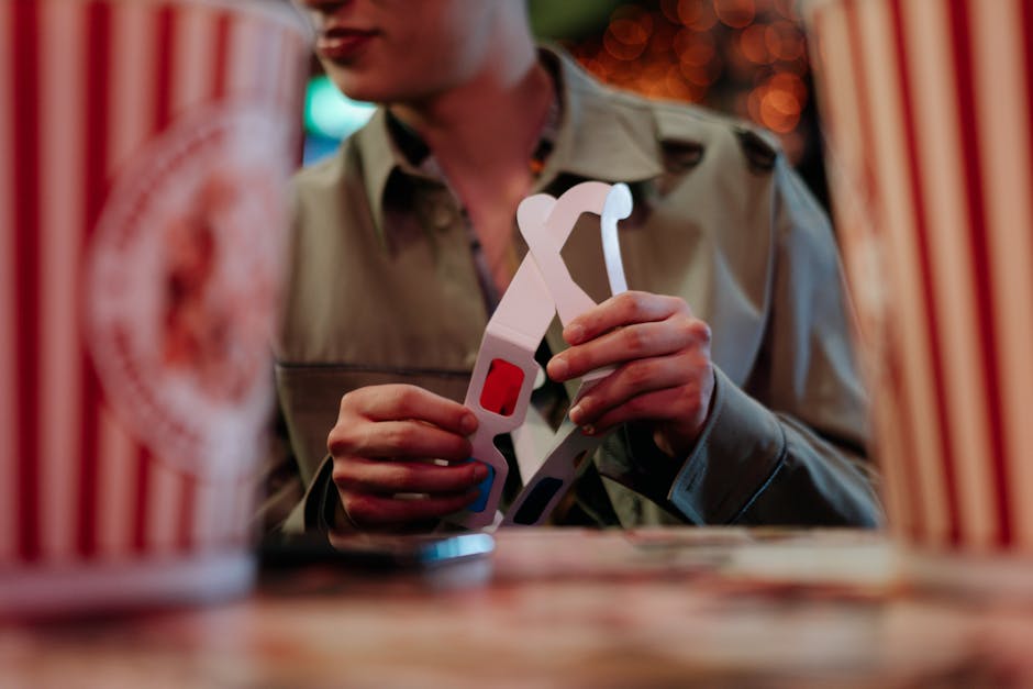 Seorang artis ternama sedang berdiskusi dengan tim kreatifnya di sebuah studio produksi konten modern.